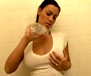 young adults rubs her hugh boobs with gas